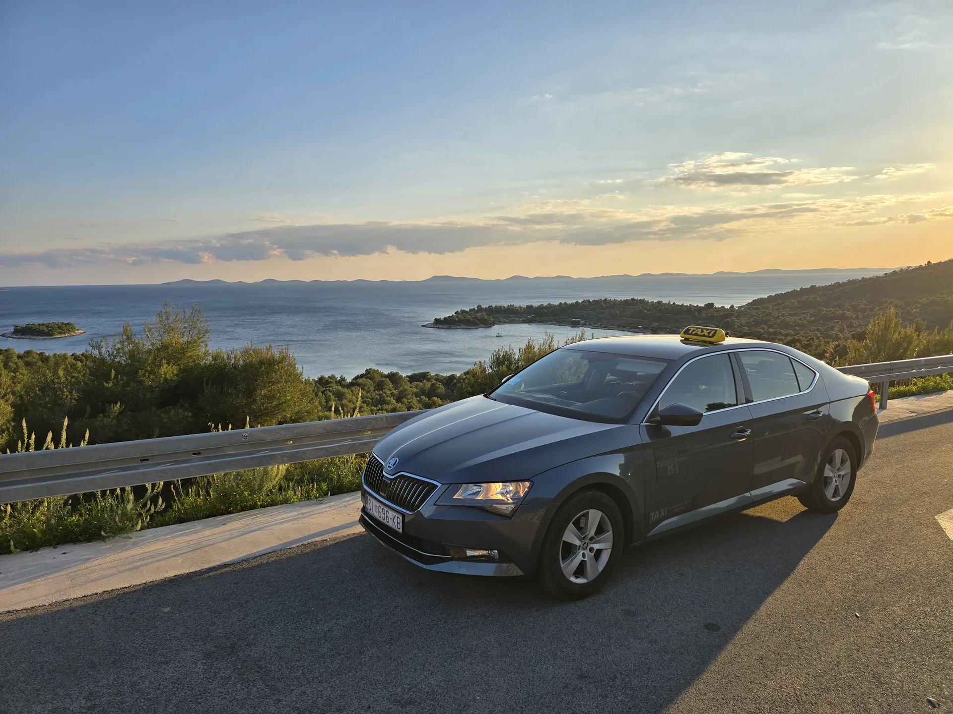 Skradin transfers: Antonio's Škoda Superb at a coastal viewpoint at sunset